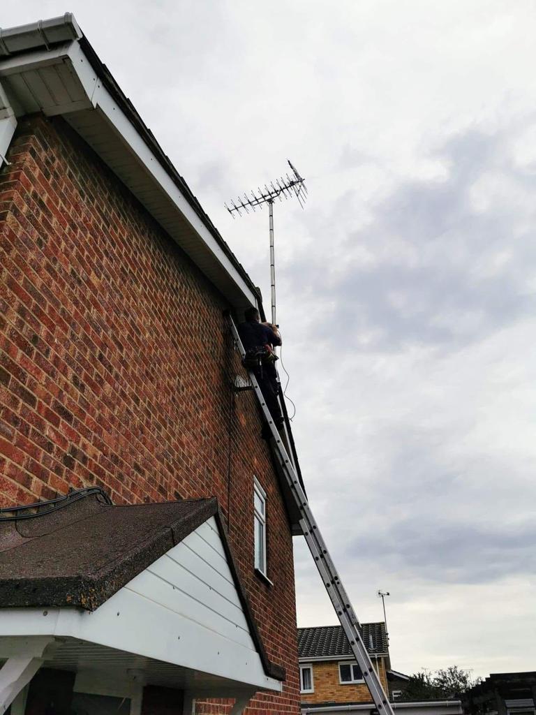 An aerial install on the side of the house